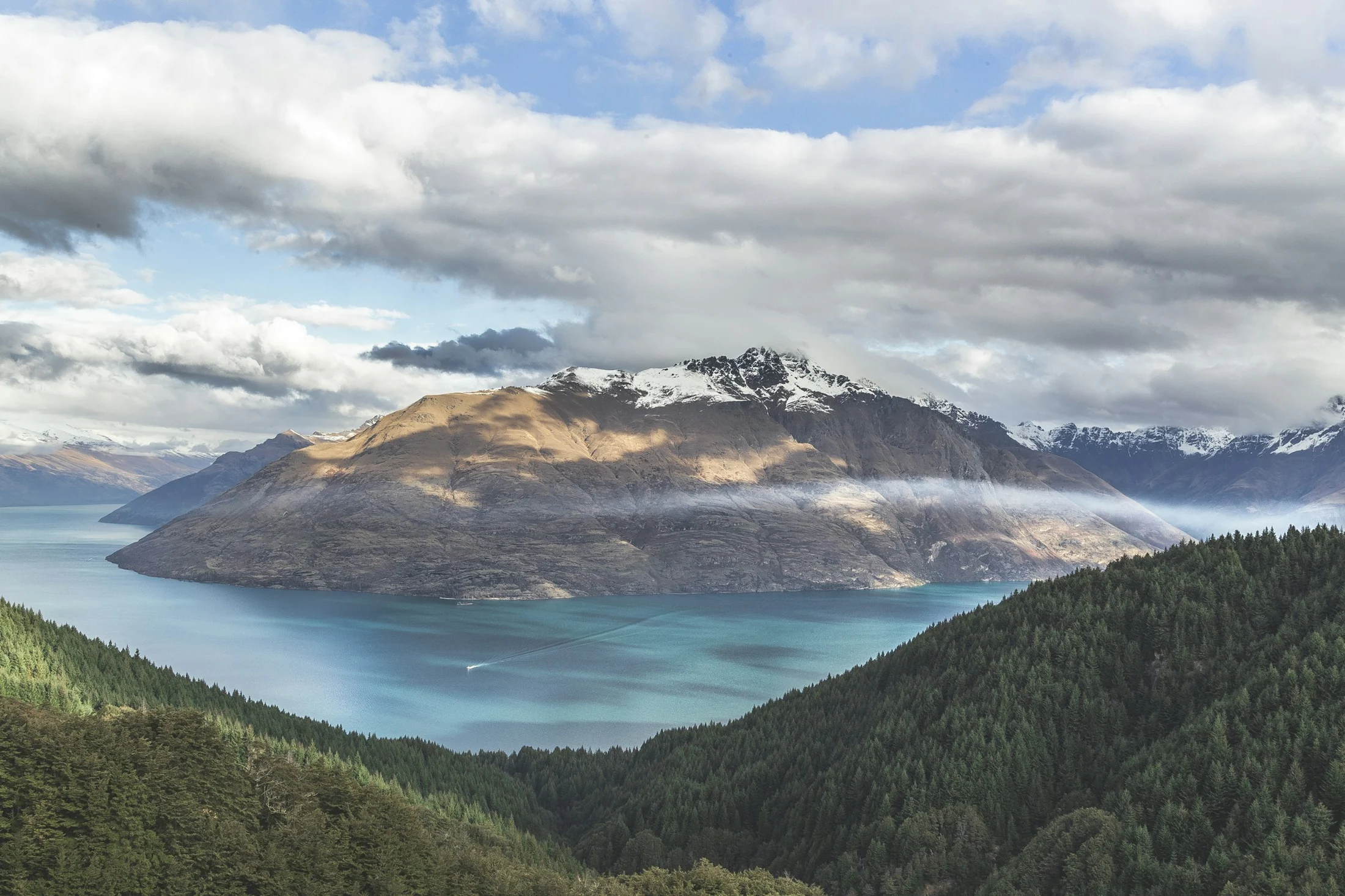 Alpine mountains and blue lake in New Zealand